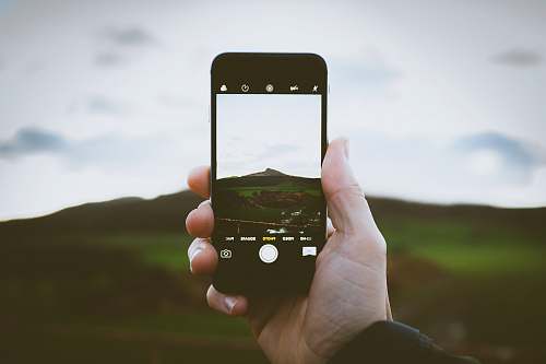 cell phone screengrab photography of mountain phone